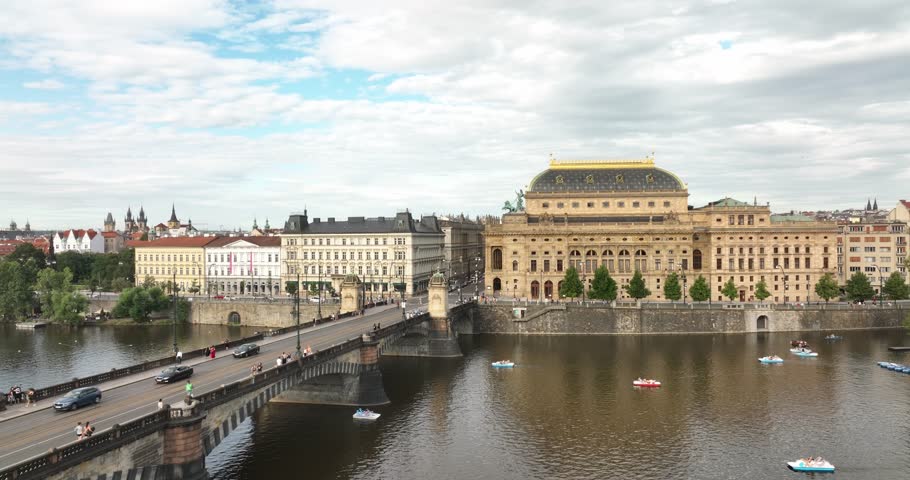 National Theatre located in Prague, Czech Republic on the Vltava River. Flight over the Prague, old town, Castle and Vltava River, Czech Republic.