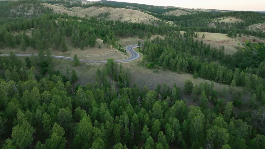 Aerial view of an empty highway winding through South Dakota