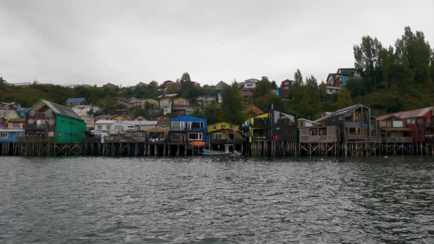 Multicolored palafitos. Colourful wooden houses on stilts. 