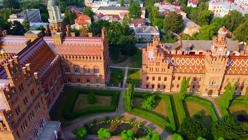 Aerial view of the Seminary Residence and the Church of the Three Saints. UNESCO. architecture. Old historical university building with towers, domes and green garden Chernivtsi, Ukraine 