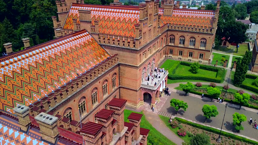 Aerial view of the Seminary Residence and the Church of the Three Saints. UNESCO. architecture. Old historical university building with towers, domes and green garden Chernivtsi, Ukraine 