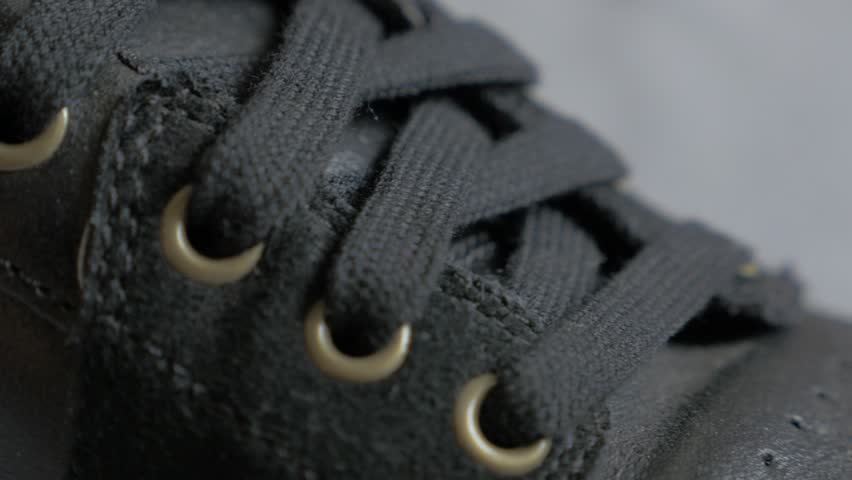 Black leather sneaker close-up details 4K 2160p UltraHD footage - Leather modern shoe laces and details 4K 3840X2160 UHD video