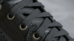 Leather black sneaker close-up details 4K 2160p UltraHD footage - Leather modern shoo laces and details 4K 3840X2160 UHD video