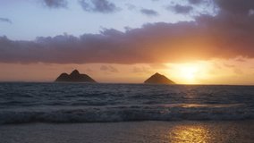 Sunrise 4k RED camera shot of colorful pink purple clouds and golden sun rising above Hawaii beach. Nature background for Travel vacation, New beginning, Inspiration view, Zen Meditation Concept video