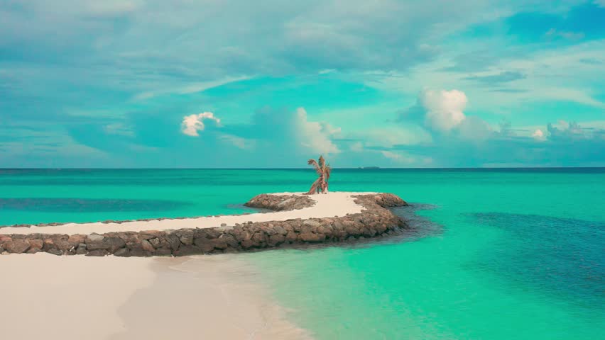 Aerial view on coast beach on local island Fulidhoo at sunset time in Maldives.