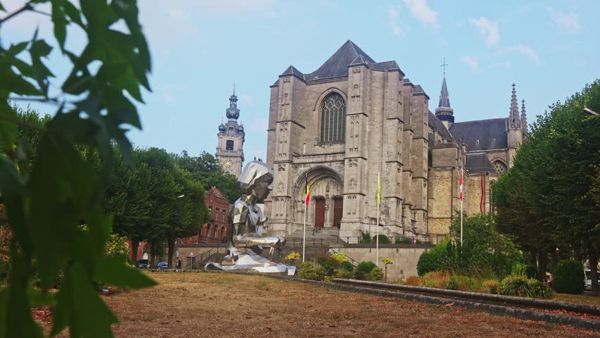 Picturesque urban landscape with a view of the majestic Catholic Cathedral of St. Waltrude in the small town of Mons, Belgium. High quality 4k footage