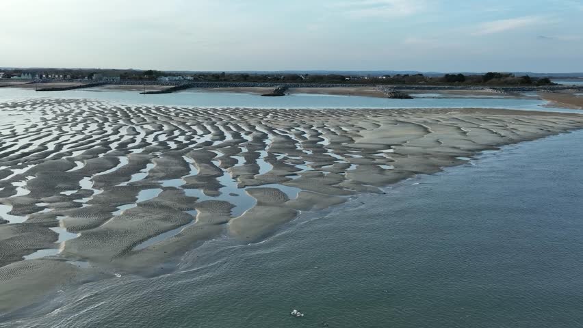 Spit at low tide. Cinematic drone flight