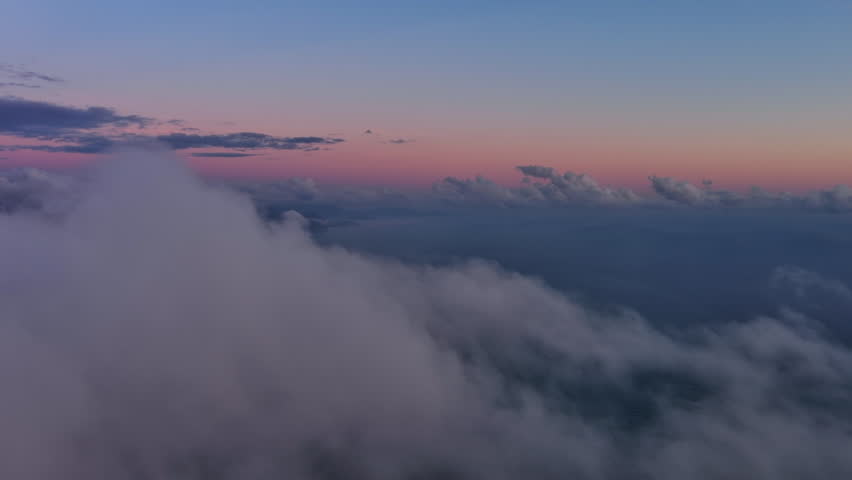 Aerial view on Adriatic sea coast with mountains and Budva city in Montenegro and dusk clouds. Travel seascape background and nature landscape, 4k