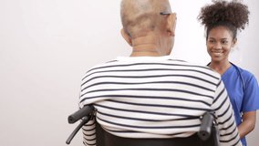Doctor nurse black woman in blue uniform talks, encourages and checks a cancer patient. World Cancer Day. - Powered by Shutterstock - Get 15% off with code: PIKWIZARD15