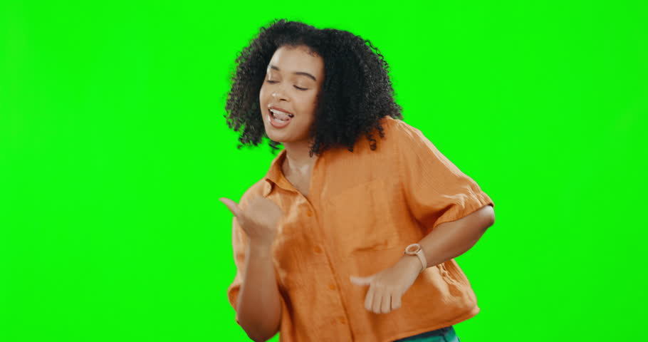 Happy, dance and woman in a studio with green screen doing a trendy moving routine for celebration. Happiness, excited and female model dancing to music or radio to celebrate by chroma key background Royalty-Free Stock Footage #1102423933