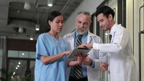 senior caucasian doctor and young intern doctor having discussion about patient diagnosis on digital tablet computer at hospital outdoor - Powered by Shutterstock - Get 15% off with code: PIKWIZARD15
