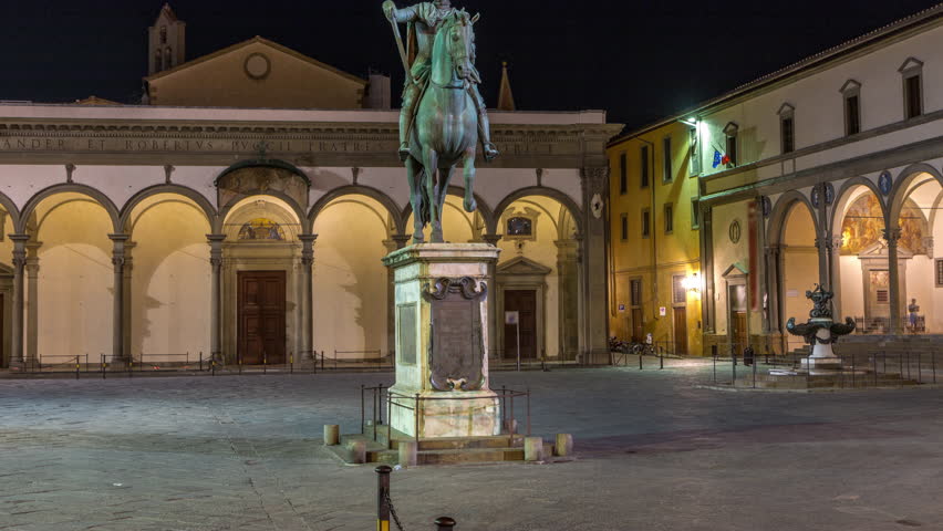 Statue of Ferdinando I de Medici front view night timelapse, Grand Duke of Tuscany, located in the Piazza della Santissima Annunziata in Florence, Italy