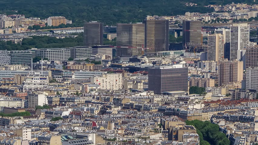Top view of Paris skyline with National Library of France from above timelapse. Main landmarks of european megapolis. Bird-eye view from observation deck of Montparnasse tower. Paris, France