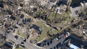 Neighborhood in Little Rock, Arkansas damaged by March 31, 2023 tornado with drone video looking down and moving forward.
