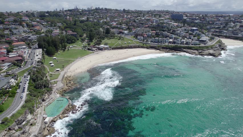 Panoramic View Over Bronte Beach In The Eastern Suburbs Of Sydney, Australia - drone shot