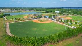 Two Baseball Teams With Players Playing During Competitive Match On A Sunny Day In Florida, USA. - Slow Aerial Pullback - Powered by Shutterstock - Get 15% off with code: PIKWIZARD15