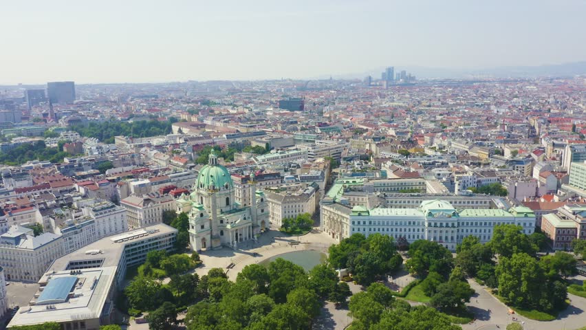 Inscription on video. Vienna, Austria. Karlskirche is a Catholic church located in the southern part of Karlsplatz in Vienna. Glitch effect text, Aerial View