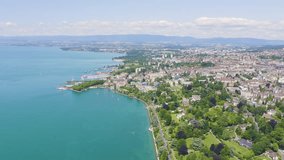 Inscription on video. Lausanne, Switzerland. Flight over the central part of the city. The coast of Lake Geneva. Flames with dark fire, Aerial View
