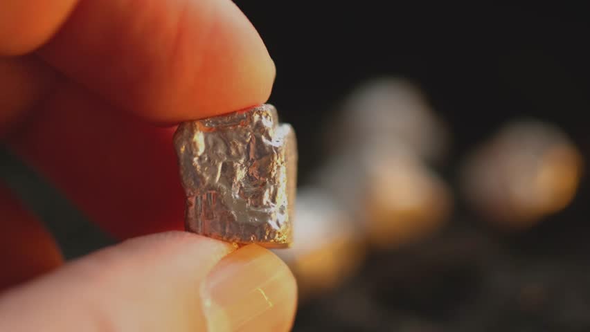 Miners hold in their hands platinum or silver or rare earth minerals found in the mine for inspection and consideration	
 Royalty-Free Stock Footage #1102451017