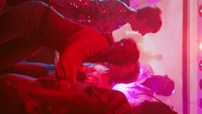 Vertical video: Persons at club interrupted by police lights, funky people stopping the music after seeing law enforcement officers. Group of friends running away from dance floor and nightclub - Powered by Shutterstock - Get 15% off with code: PIKWIZARD15
