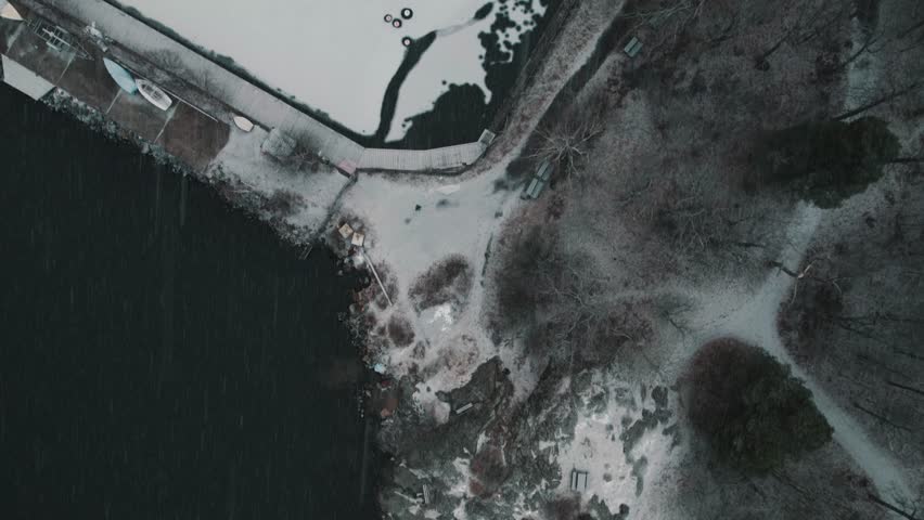 Aerial view of Angsholmen in Hundudden frozen harbor in winter, Djurgårdsbrunn, Stockholm, Sweden.