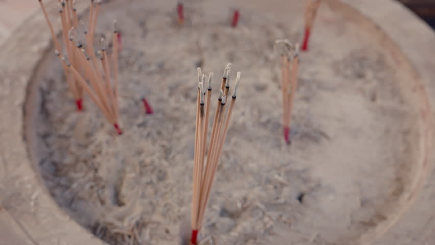 4K, Slow, Close-up nine red incense sticks in incense burner, after people have finished praying or making wish from holy things, put it in incense burner with faith after finished making wish. | Shutterstock HD Video #1102464459
