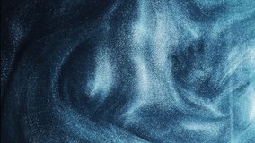 Glitter fluid. Sparkling wave. Ink water. Metallic blue color glowing shimmering grain particles texture smoke cloud motion on dark abstract background. - Powered by Shutterstock - Get 15% off with code: PIKWIZARD15