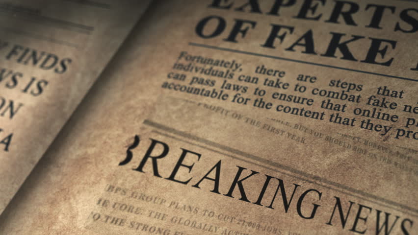 Old newspaper from an archive presents a FAKE NEWS headline Royalty-Free Stock Footage #1102468119