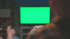 Couple of Gamers Playing Video Game with Console Controllers on Green Screen for Chroma Key. Man and Woman Have Fun with PC Player Controls. Two People and Isolated Greenscreen for Chromakey Closeup - Powered by Shutterstock - Get 15% off with code: PIKWIZARD15