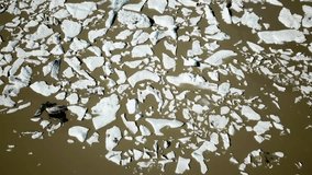 Aerial drone footage of Fjallsarlon glacier lagoon with plenty of icebergs floating in a lake, Iceland. Scenic view of Ice bergs. Artic nature ice landscape. Melting glacier in Iceland. Climate change