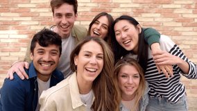 Happy group of young friends smiling at camera outdoors. Portrait of multiracial student people having fun together. - Powered by Shutterstock - Get 15% off with code: PIKWIZARD15