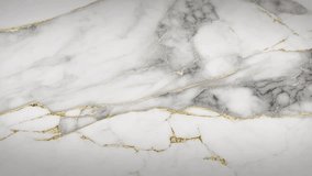 White Marble with gold lines Luxury background texture. Slow panoramic motion. High detailed 4K video.  Marble pattern texture surface panning background. Marble stone texture. 