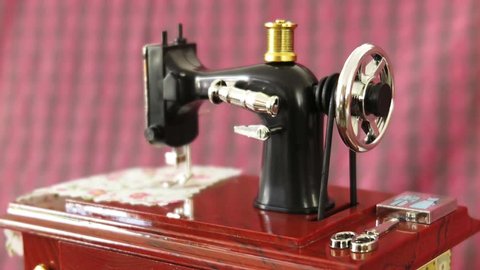 Sewing machine model is in action with dreamy effect