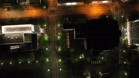 Downtown Baton Rouge, Louisiana at night with drone video looking down and moving forward.