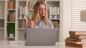 Caucasian happy female student girl at home library studying online with books laptop distant education writing homework task e-learning. Woman businesswoman corporate study with computer write ideas - Powered by Shutterstock - Get 15% off with code: PIKWIZARD15