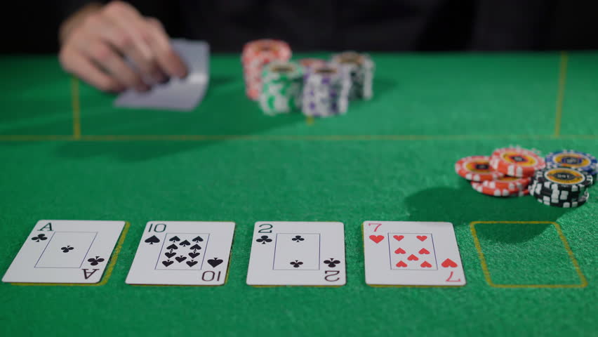 Gamer person playing poker in casino. Betting chips stacks. Call and raise. Card game on green table. Gambling. Texas Hold'em. Dealer and gambler, fortune.