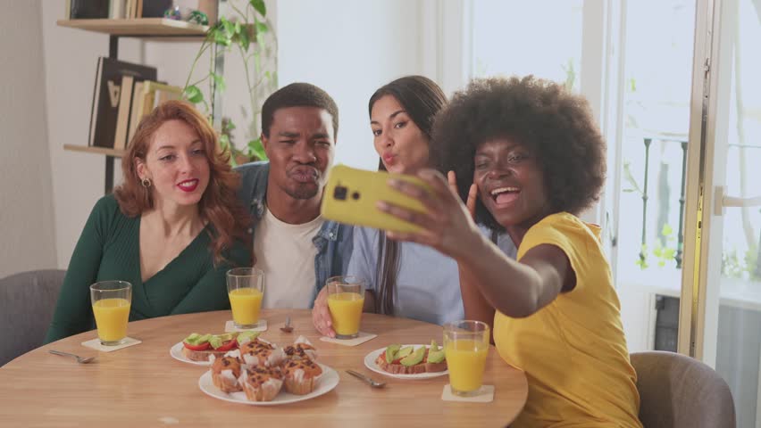 Multiethnic friends having fun while taking a selfie during breakfast Royalty-Free Stock Footage #1102483419