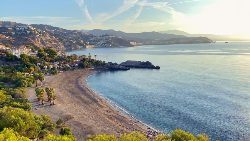 View of the empty Marina del Este beach at the Mediterranean Sea near city Almunecar at Costa Tropical, Southern Spain Royalty-Free Stock Footage #1102483871