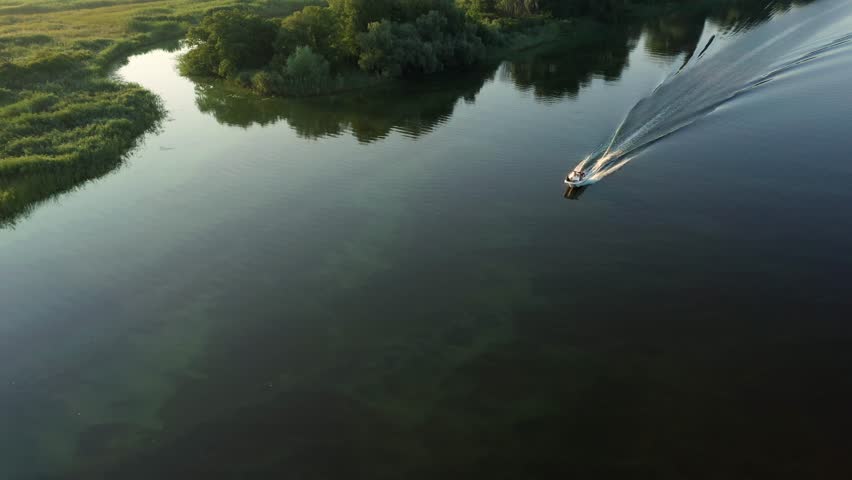 Aerial morning view to motorboat at Dnieper river near Cherkasy, Ukraine | Shutterstock HD Video #1102485691
