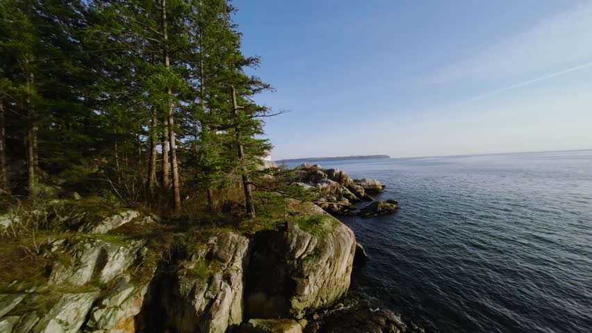 Maneuverable fast flight along coastal line in Lighthouse Park West Vancouver