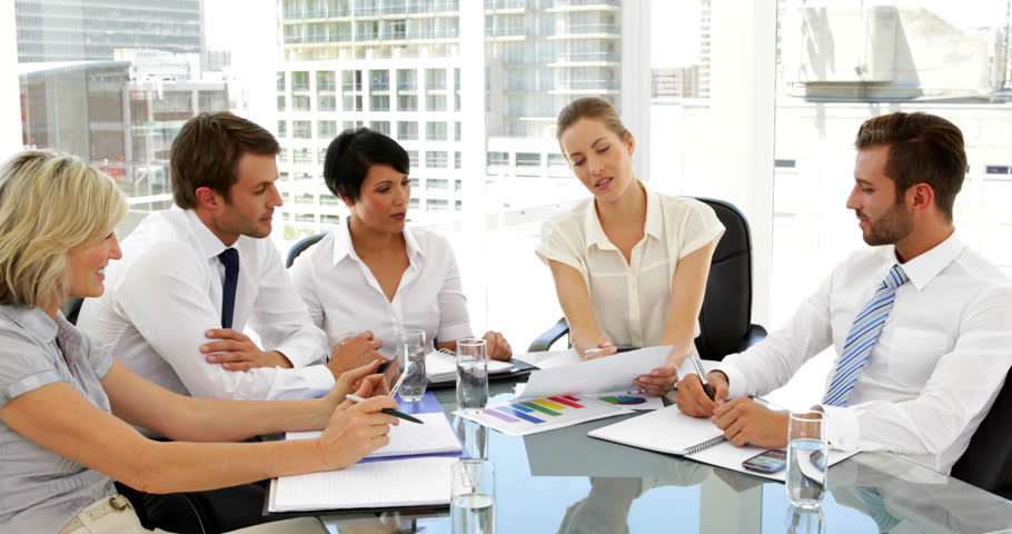 Animation of stock market data processing over diverse businesspeople discussing together at office. Global economy and business technology concept