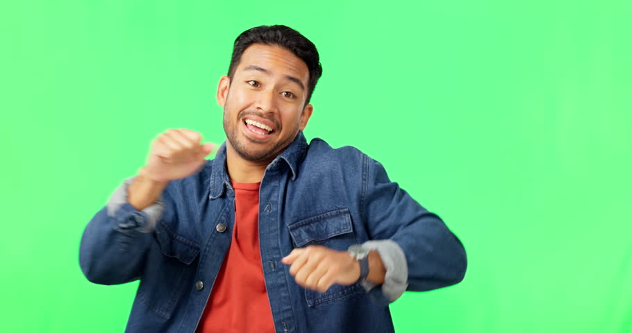 Crazy, dance and man with comedy in green screen excited with music and smile. Isolated, studio background and happy male model with celebration, energy and dancing with freedom and hip hop move Royalty-Free Stock Footage #1102498351