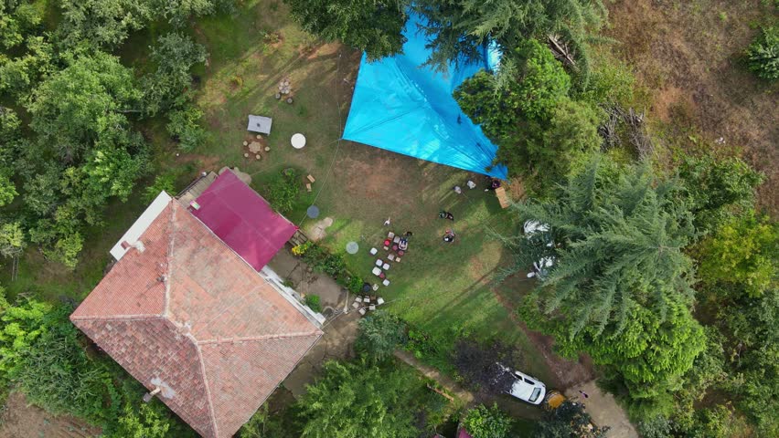 4k Drone shot zooming out vertically from a village house surrounded by trees in trabzon