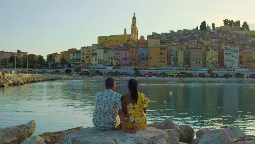 Menton France, couple men and woman on vacation at the Cote d Azur France, View on the old part of Menton, Provence-Alpes-Cote d'Azur, France Europe French Riviera Royalty-Free Stock Footage #1102503885
