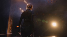 Graceful female dancer performs on theater stage illuminated by spotlights. Ballerina in training suit dances and practices ballet movements at choreography rehearsal. Art of classical ballet dance. - Powered by Shutterstock - Get 15% off with code: PIKWIZARD15