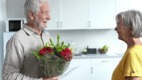 Old man giving flowers at his wife sitting on the sofa at home for the San Valentines’ day. Pensioners enjoying surprise together. In love people having fun.
 - Powered by Shutterstock - Get 15% off with code: PIKWIZARD15