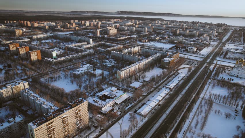 Aerial view. Winter panorama of the city of Tolyatti in the Samara region. Snow-covered streets of a provincial and industrial Russian city. Royalty-Free Stock Footage #1102519801
