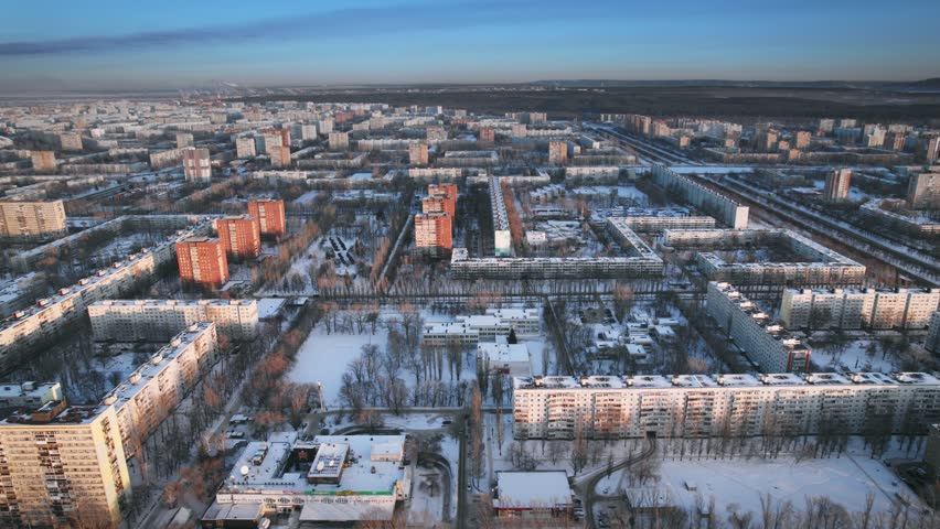 Aerial view. Winter panorama of the city of Tolyatti in the Samara region. Snow-covered streets of a provincial and industrial Russian city. Royalty-Free Stock Footage #1102519803