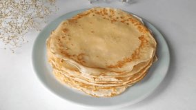 Thin pancakes with milk. Video with pancakes and female hands. Pancakes for breakfast