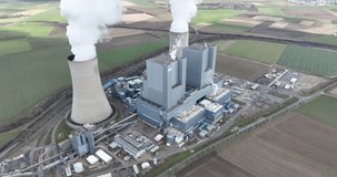 An impressive drone video of a massive industrial power plant with iconic cooling towers, showcasing modern energy production at scale.